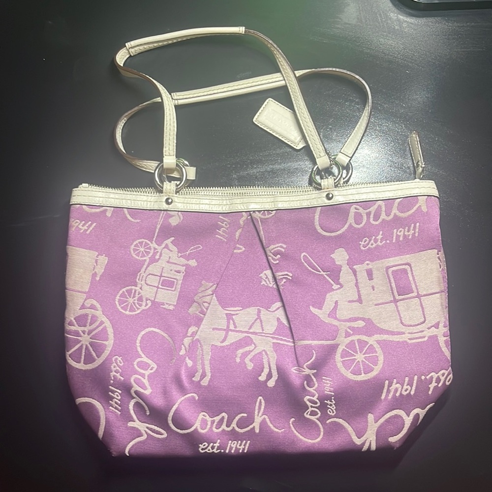 This is a limited edition purple coach bag from the 2000’s.